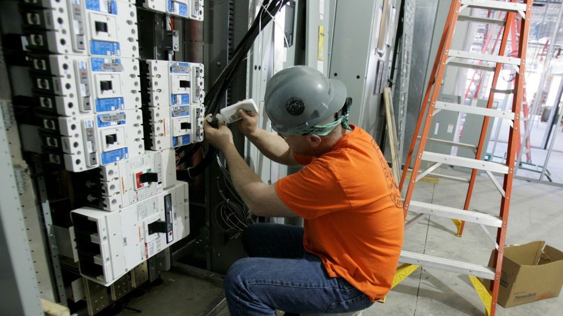 Man Fixing Switchboard ()